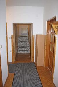 a hallway with stairs leading into a room with a hallway at F.E.Matras-Gasse 9 in Vienna