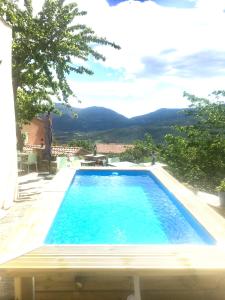 a swimming pool with a view of the mountains at Casa di Emma in Santo-Pietro-di-Tenda