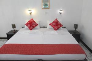 En eller flere senger på et rom på Hotel Thai Lanka