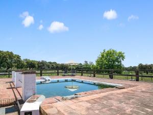 basen w ogrodzie z ogrodzeniem i drzewami w obiekcie Holiday Home in Aracena with Private Pool w mieście Aracena