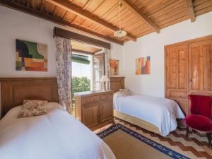 Łóżko lub łóżka w pokoju w obiekcie Holiday Home in Aracena with Private Pool