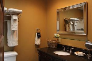 a bathroom with a sink and a mirror at The Drift Inn in Rupert +64 photos