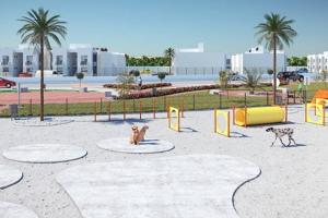two dogs sitting in a playground in a park at Casa Familiar en Cluster Privado. in Veracruz