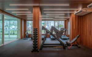 a gym with cardio equipment in a large room at Salinas Exclusive Resort in Salinópolis