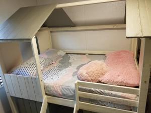 a bunk bed with two pink pillows on it at Private Pet Friendly Home Near Exotic Deer Farm Close to Pigeon Forge, Gatlinburg TN in Sevierville