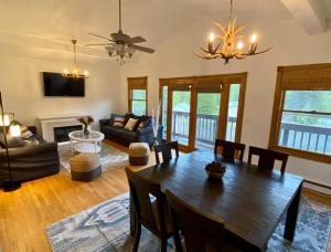 a living room with a wooden table and a couch at Catskill Seasons Inn in Shandaken