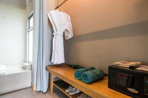 a room with a table with towels on a wall at KC Grande Resort Koh Chang in Ko Chang