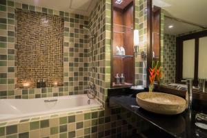 a bathroom with a sink and a bath tub at KC Grande Resort Koh Chang in Ko Chang
