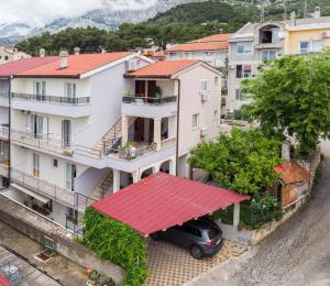 a car parked in front of a building at Iva Apartment in Makarska