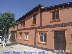 a brick house with a family guest house friends at Family Guest house - Friends-J in Nukus