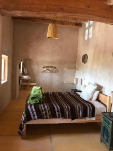 Postel nebo postele na pokoji v ubytování Kasbah Timdaf + 37 fotografií
