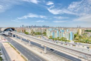 an overhead view of a highway in a city at Splendid 2BR in Victoria Residency Al Furjan by Deluxe Holiday Homes in Dubai