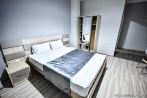 Postel nebo postele na pokoji v ubytování Hotel Wave