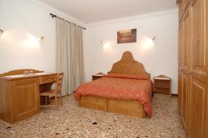 Postel nebo postele na pokoji v ubytování Alloggi B&b Allegri