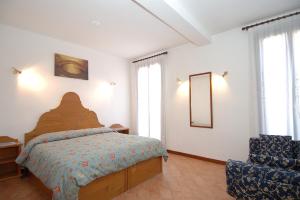 Postel nebo postele na pokoji v ubytování Alloggi B&b Allegri