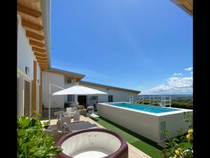 a backyard with a swimming pool and a house at TheVilla holiday in Silvi Marina
