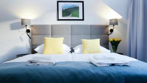 Łóżko lub łóżka w pokoju w obiekcie Hotel Rezydencja AS & Spa-Najwyżej w Karpaczu