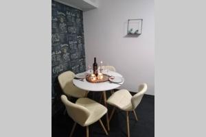 a dining room with a white table and chairs at La Monica 3 - Cazare Straja - Lupeni - Retezat - Parang in Lupeni +8 photos