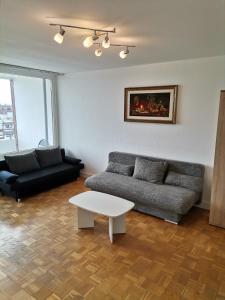 a living room with a couch and a table at Wohnung 4 Personen in Hannover