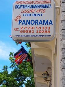 a sign for a restaurant on a building with a flag at 85 m² Apartments New Panorama (under new management) in Paralio Astros