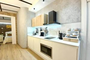 a kitchen with a sink and a counter top at Ca Cici Venice Loft Apartment in Venice