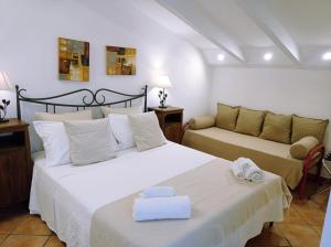 a bedroom with two beds with towels on them at Residence e B&B Villamirella in Palinuro +210 photos