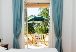 Ένα ή περισσότερα κρεβάτια σε δωμάτιο στο Hotel Marko