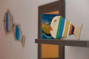 a toy train on a shelf in front of a mirror at Residence Costa d’Otranto in Otranto