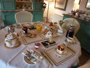 a table with a tea set on it at Yr Hen Felin - The Old Mill B&B in Morfa Nefyn +33 photos