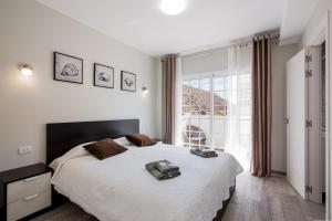 a bedroom with a large bed and a large window at Palm Mar de LUX A32 in Palm-mar +46 photos