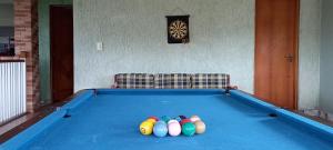 a pool table with balls on top of it at Sobrado Igarata in Igaratá