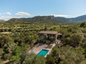 an aerial view of a house with a swimming pool at Villa Muscarolas By home villas 360 in Pollença