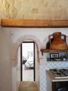 Kuchyň nebo kuchyňský kout v ubytování Trulli Bosco Selva