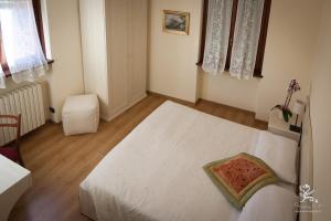Cama ou camas em um quarto em Il Grifo