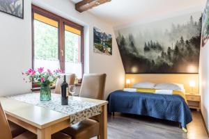 Posteľ alebo postele v izbe v ubytovaní Dolina Resort Zakopane