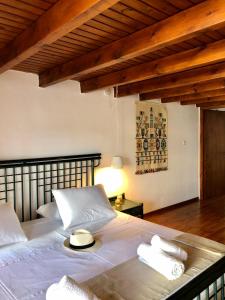 Säng eller sängar i ett rum på Villa Smaragdi-Despoina