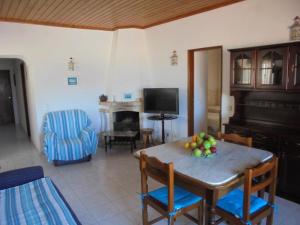 a living room with a table with fruit on it at Ema's Beach and Nightlife House in Lagos