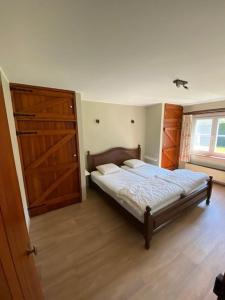 Een bed of bedden in een kamer bij Villa 'T Zeehuysje