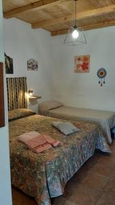 Ένα ή περισσότερα κρεβάτια σε δωμάτιο στο Casa Vacanza e Camera Fabiola