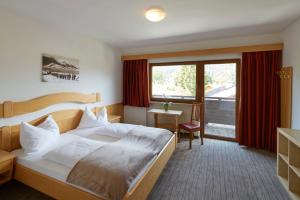 Posteľ alebo postele v izbe v ubytovaní Sonnenburg Hotel