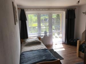 Posteľ alebo postele v izbe v ubytovaní Apartament i pokoje u Piotra