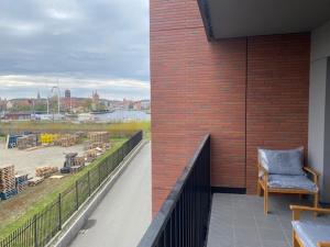Posedenie v ubytovaní APARTAMENT NAD MOTŁAWĄ Z WIDOKIEM