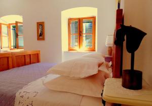 Postel nebo postele na pokoji v ubytování Villae Dalmaticae - Kastil