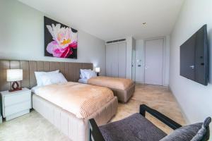 A bed or beds in a room at The View Bodrum