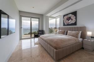 A bed or beds in a room at The View Bodrum
