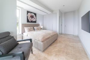 A bed or beds in a room at The View Bodrum