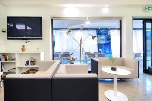 TV a/nebo společenská místnost v ubytování Hotel Da Mario
