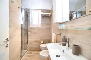 Koupelna v ubytování Hotel Da Mario + 28 fotografií