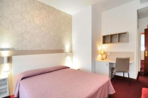 Postel nebo postele na pokoji v ubytování Hotel Da Mario