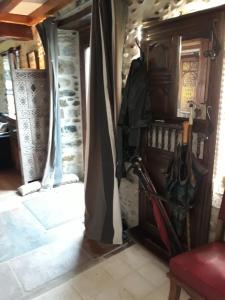 a room with umbrellas hanging from a wall at Maison Mignaquy in Charritte-de-Bas +44 photos